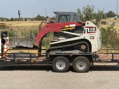 Takeuchi TL10 track loader on its trailer