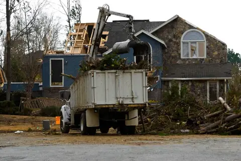 Storm debris loaded into a dump truck