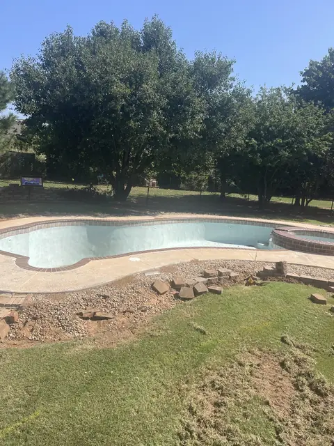 Backyard swimming pool before removal