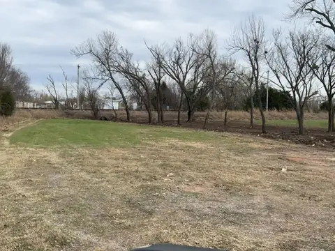 Graded lot with a tree line